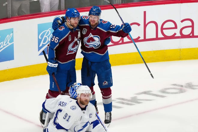 Colorado Avalanche right wing Valeri Nichushkin (13) celebrates his second-period goal against the Tampa Bay Lightning with right wing Mikko Rantanen (96).