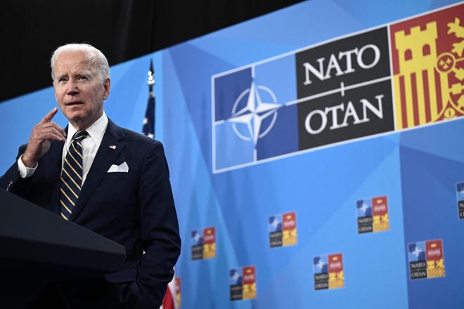 President Joe Biden talks to reporters during a news conference at the close of the NATO summit in Madrid.