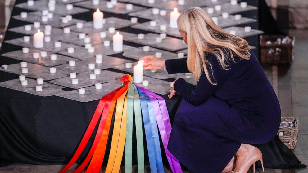 Norway's Crown Princess Mette-Marit lights candles during a service in Oslo Cathedral, Oslo, Sunday June 26, 2022, after an attack in Oslo on Saturday. A gunman opened fire in Oslo’s nightlife district early Saturday, killing two people and leaving m