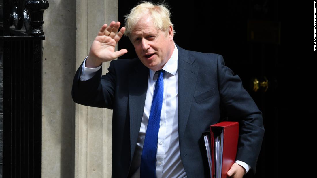 After dozens of British lawmakers resign, Boris Johnson clings to power
