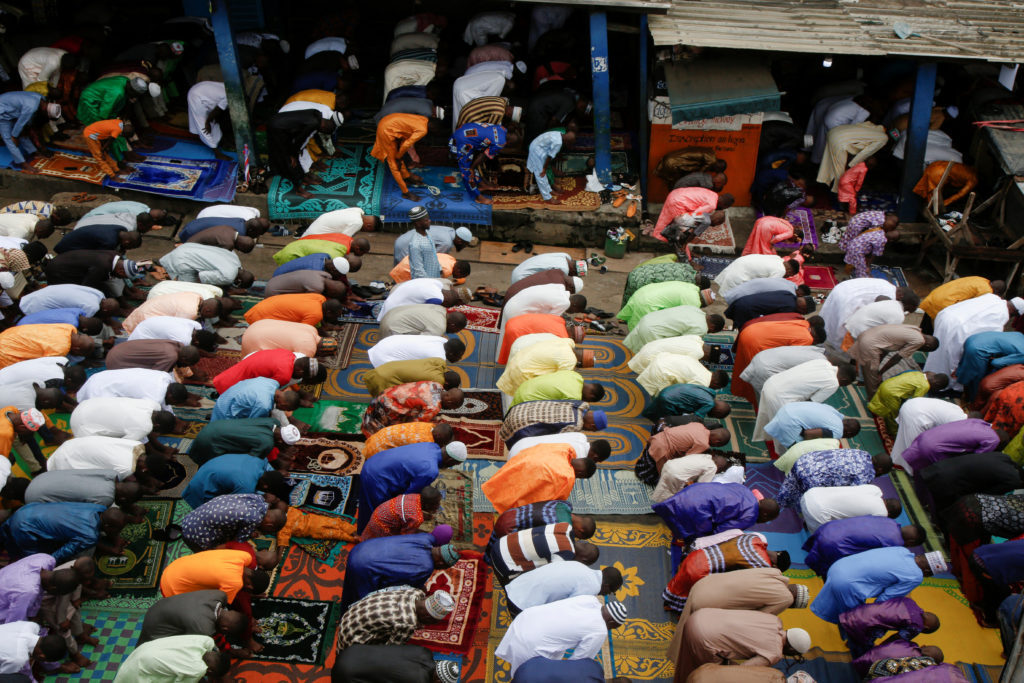 Worshippers attend prayers marking the Muslim festival of sacrifice Eid al-Adha in Attecoube, an area of Abidjan