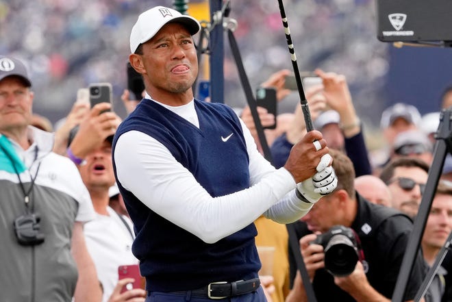 Tiger Woods tees off on the fourth hole during the first round of the 150th Open Championship at St. Andrews Old Course.